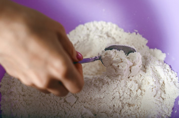 Wheat white flour in cooking bowl bakery, close up