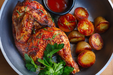grilled chicken with baby potatoes and tomato sauce