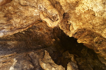 Uneven surface of old wood with dark cracks patterns 