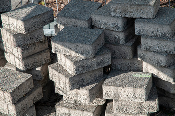 concrete paving stones stacked at construction site