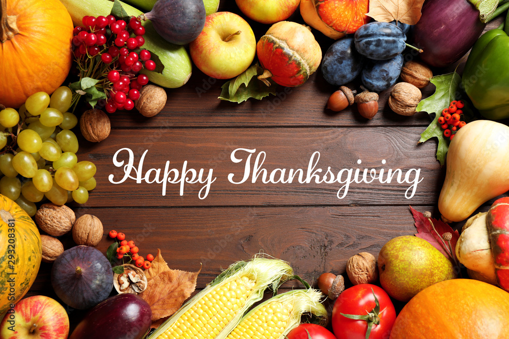 Sticker Flat lay composition with autumn vegetables and fruits on wooden table. Happy Thanksgiving day