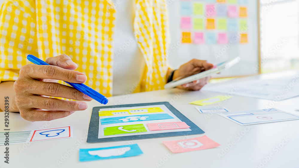 Wall mural creative web designer planning application and developing template layout, framework for mobile phon