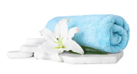 Obraz na płótnie Canvas Composition with towel, spa stones and fresh flower isolated on white