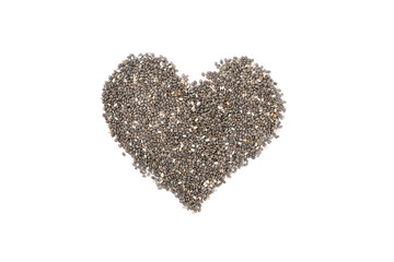 Heart laid out of chia seeds isolated on white background