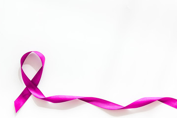 Lavender ribbon is symbol of Alzheimers disease on white background top view copy space