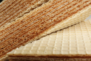 Delicious crispy wafers as background, closeup view