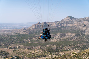 Obraz premium Paragliding flying on the hillside of Palomaret.