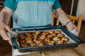woman making traditional Christmas sweets and desserts