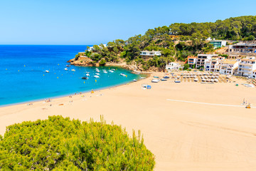 View of sandy beach in Sa Riera coastal fishing village, Costa Brava, Catalonia, Spain