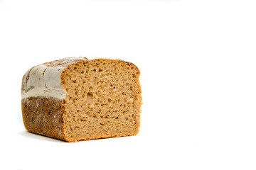 Fototapeta na wymiar Dark bread isolated on a white background. The concept of baking bread, eating meals with rolls, bread. Product made of wheat and rye flour, bread preparation.