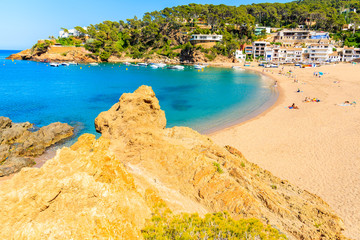 Naklejka na ściany i meble View of Sa Riera beach and fishing village in background, Costa Brava, Catalonia, Spain