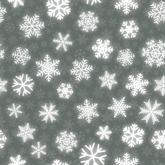 Fototapeta na wymiar Christmas seamless pattern of white snowflakes of different shapes on gray background