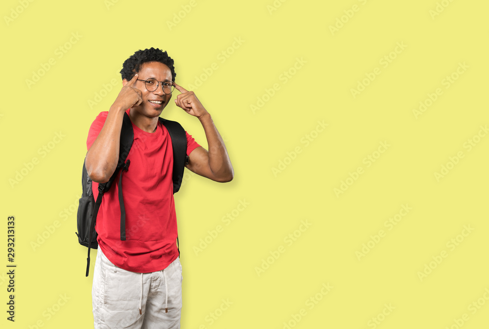 Wall mural happy young man doing a gesture of concentration