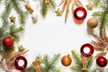 Christmas flat lay, Fir branches decorated with festive balls and Christmas decor on a white mocup background with copy space