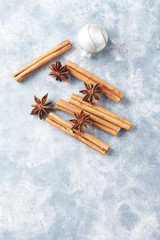 Star anise with cinnamon. Christmas spices on rustic wooden background. Top view. Copy space. 