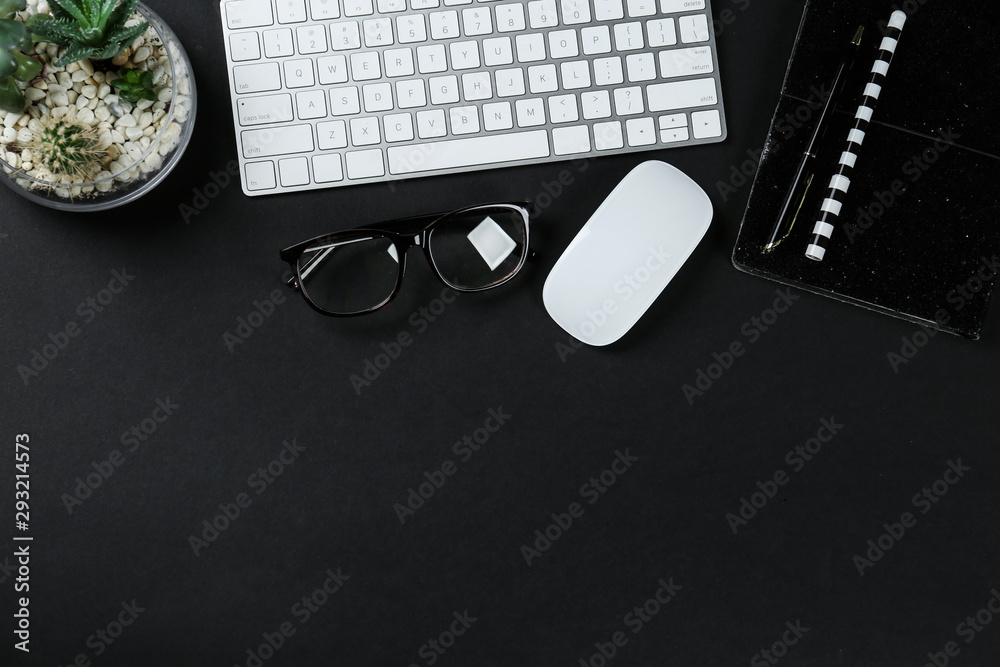 Fototapete flat lay composition with computer keyboard and notebook on black background, space for text. graphi