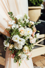 Arch for the wedding ceremony, decorated with cloth and flowers