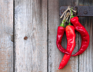 Red Hot Pepper On A Wooden Background