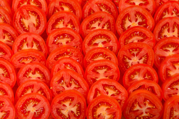 Sliced tomato background. Top view.