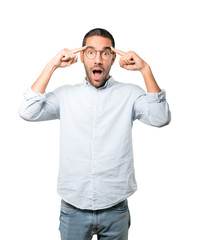 Fototapeta premium Surprised young man doing a gesture of concentration
