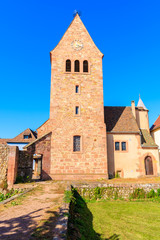 Fototapeta na wymiar Church tower in Kientzheim village on Alsatian Wine Route, France