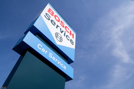 SIEGEN, GERMANY - April 22, 2018: Bosch Car Service sign against blue sky. Bosch Car Service is an international workshop concept for the maintenance and repair of motor vehicles.