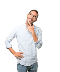 Surprised young man making a gesture of doubt