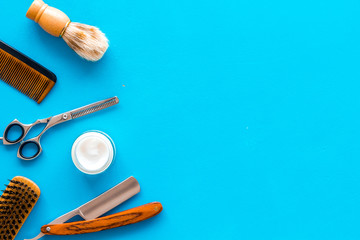 Men's hairdressing. Equipment on blue background top view copy space