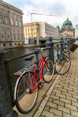 Fototapeta premium Bicycles By The River Spree Near Berlin Cathedral, Berlin, Germany