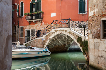 Fototapeta na wymiar One of the bridges connecting streets in Venice, Italy