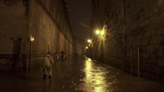  Street of the old town of Santiago de Compostela at night on a rainy day