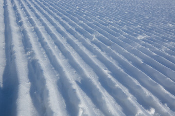 Fototapeta na wymiar Snow lines made from a snow machine