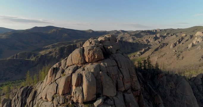 Aerial: Idyllic rocky mountains against sky at remote location - Ulaanbaatar, Mongolia