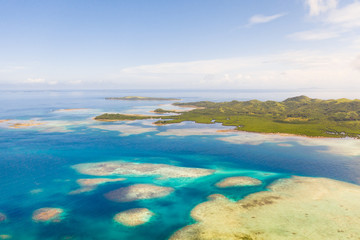 Fototapeta na wymiar Bucas Grande Island, Philippines. Beautiful lagoons with atolls and islands, view from above. Seascape, nature of the Philippines.