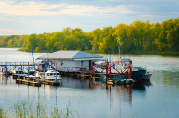 Fototapeta premium barge on the river near the river trays landscape autumn selective focus