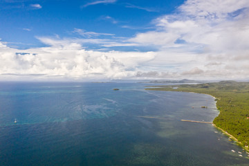 Beautiful seascape. Sea with lagoons and islands, blue sky with big clouds. Philippine nature.