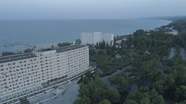 Aerial view. Big resort complex located by the coast of Mediterranean Sea. Resort complex located next to Kallithea village, Greece4K