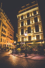 Fototapeta na wymiar Apartment building by night around Republique, Paris, France.