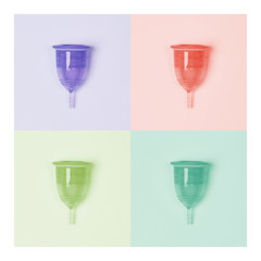 Collage in trend colors. Four menstrual cups close-up on a colour background. Pink, yellow, blue, green. Zero waste concept, eco-friendly lifestyle, reduced consumption