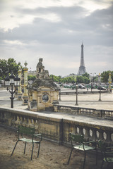 Statue next to Place de la Concorde and Eiffel Tower in background, Paris, France.