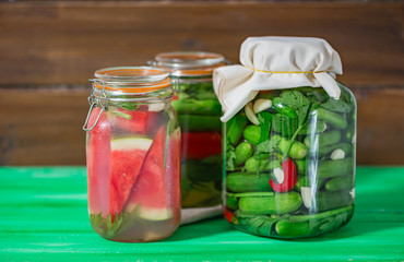 Fototapeta na wymiar Preserves or pickled vegetables in glass jars.