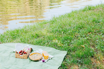 Morning picnic in the park. Tasty food. Snacks and fruits. Picnic basket. Lifestyles