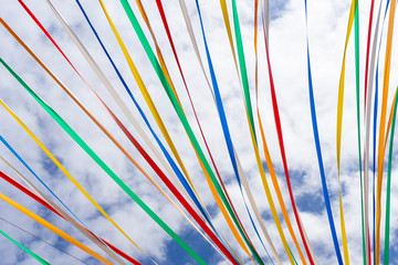 Multicolored ribbons flying in windy weather. Color, colored.