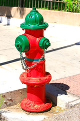Fototapeta na wymiar Red and Green fire hydrant in downtown Bisbee AZ