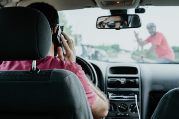 man driving a car talking on the phone, accident.crosswalk