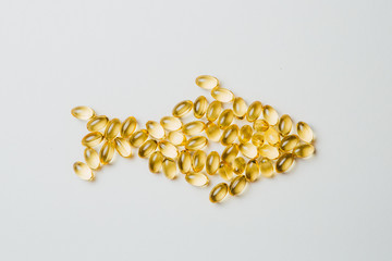 A fish made out of yellow pills