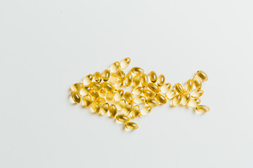 A fish made out of yellow pills