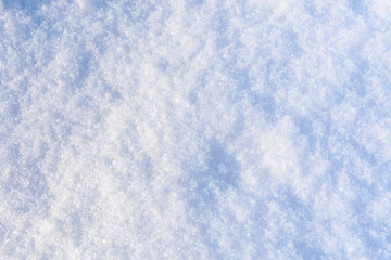 Texture of the white fluffy snow for background