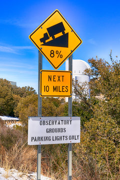 Yellow traffic sign - 8% gradient for the next 10 miles at Kitt Peak in Arizona