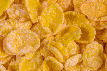 Background of the many yellow cornflakes. Healthy eating